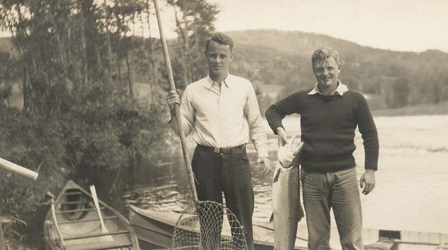 two men fishing black and white